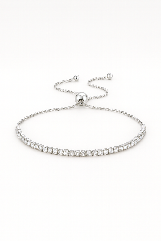 Silver bracelet with small beads on a white background